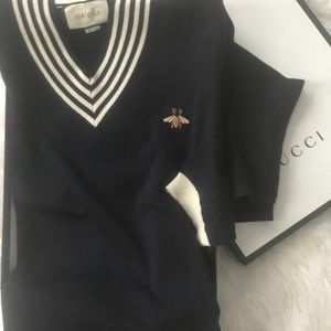 sweater with bee logo